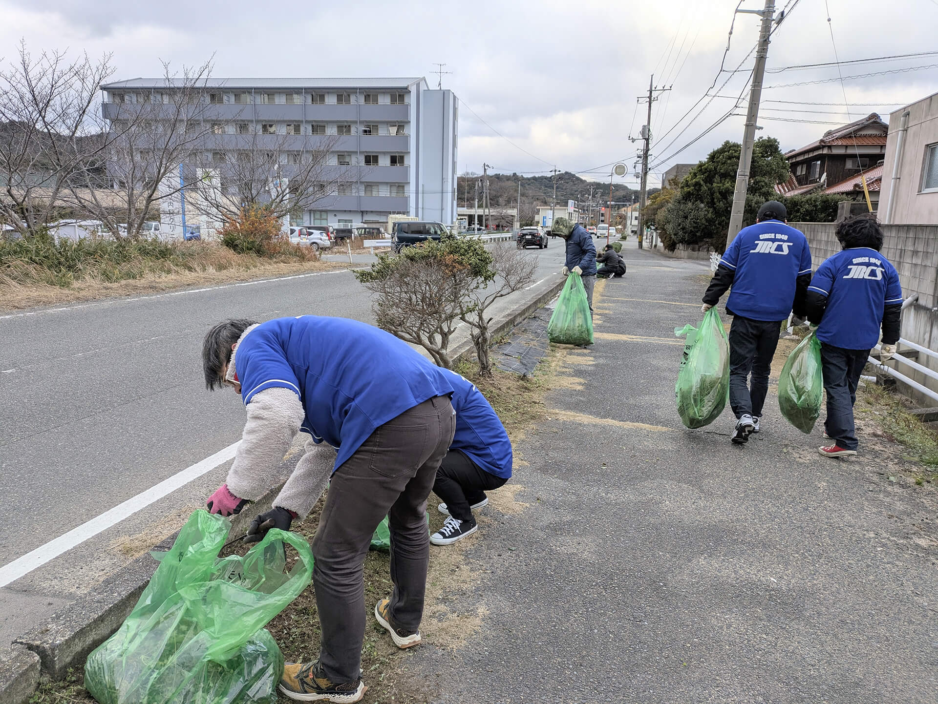 New employees and management worked together to clean up the local community.